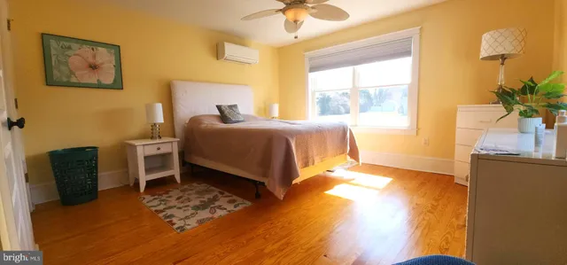 a bedroom with a bed and a chair