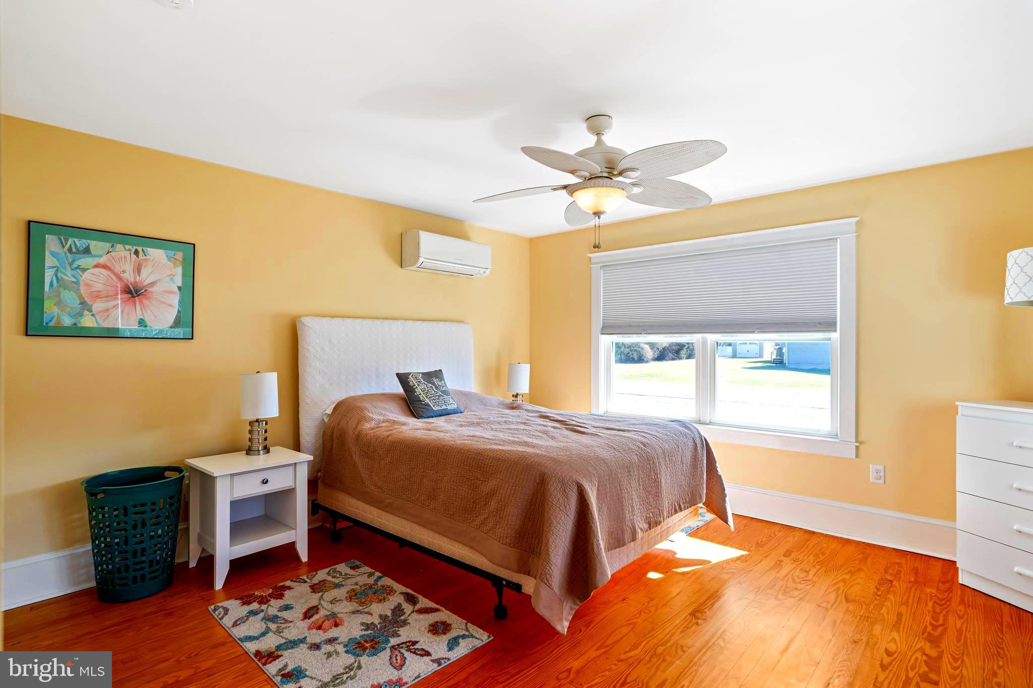 19773 Old Landing Road Rehoboth Beach, DE 19971 - Photo 34 of 54 a bedroom with a bed and a window