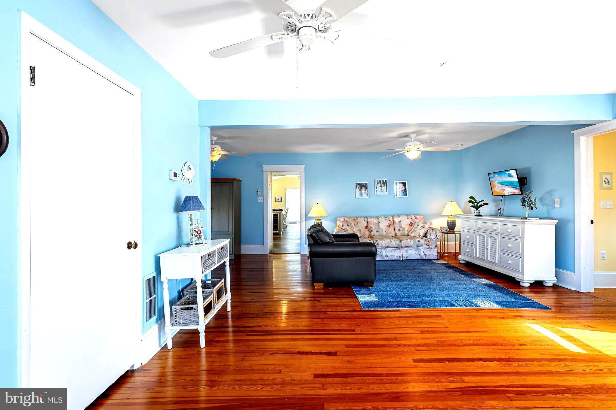 19773 Old Landing Road Rehoboth Beach, DE 19971 - Photo 4 of 54 a living room with furniture and a wooden floor