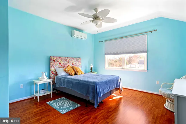 a bedroom with a bed and a mirror