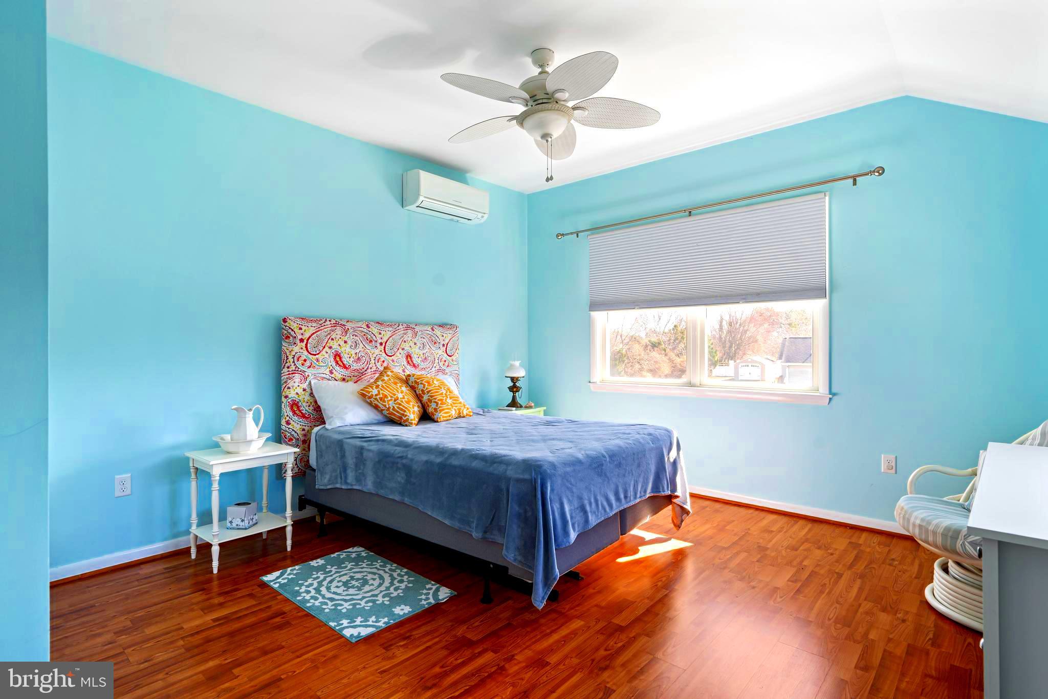 19773 Old Landing Road Rehoboth Beach, DE 19971 - Photo 44 of 54 a bed sitting in a bedroom next to a window