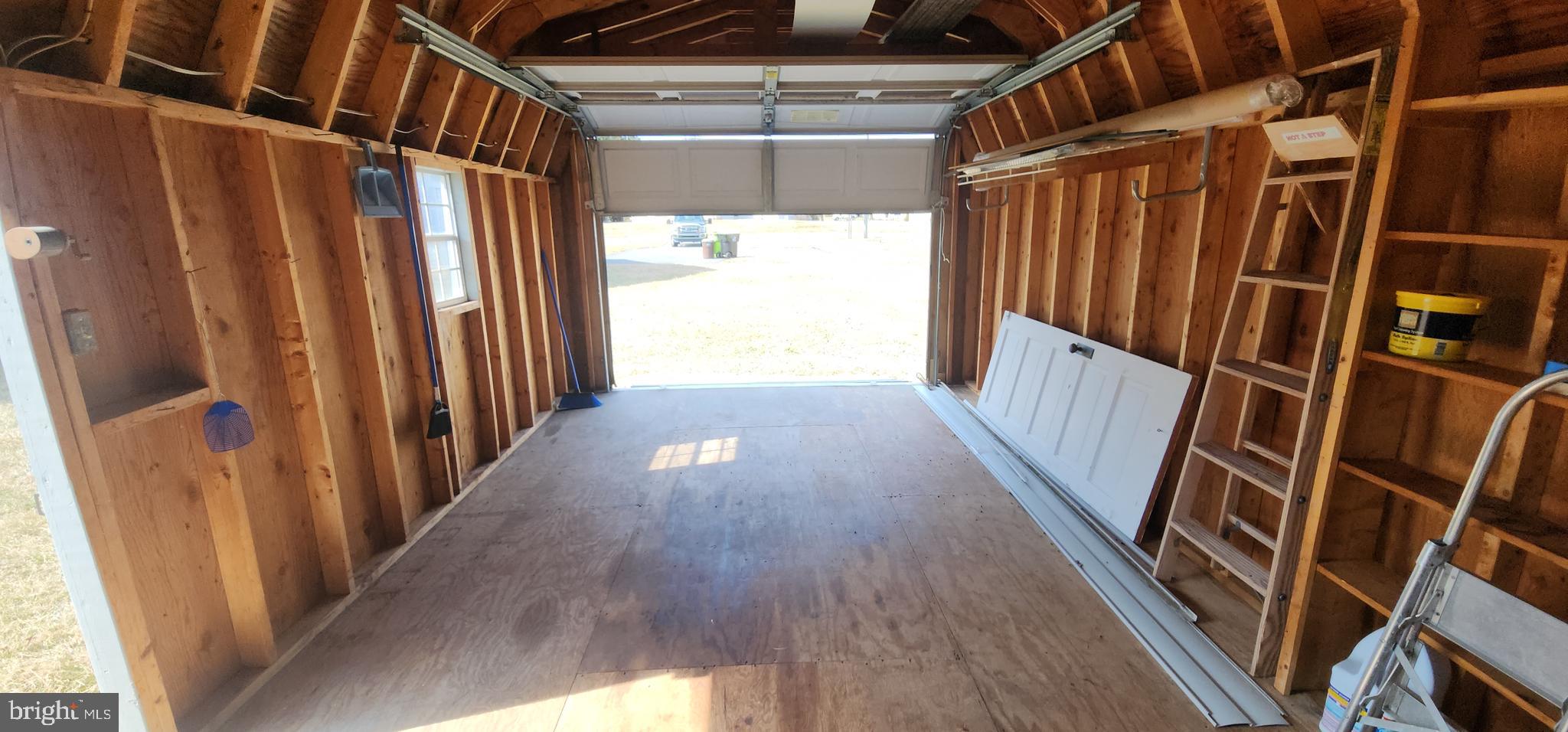 19773 Old Landing Road Rehoboth Beach, DE 19971 - Photo 50 of 54 a view of a hallway with wooden floor and door