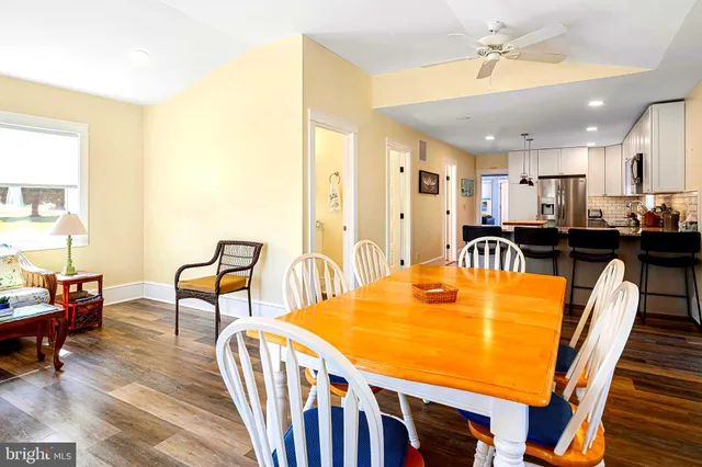 a view of a dining room with furniture and a table