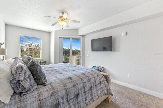 a bathroom with a granite countertop sink a toilet and bathtub