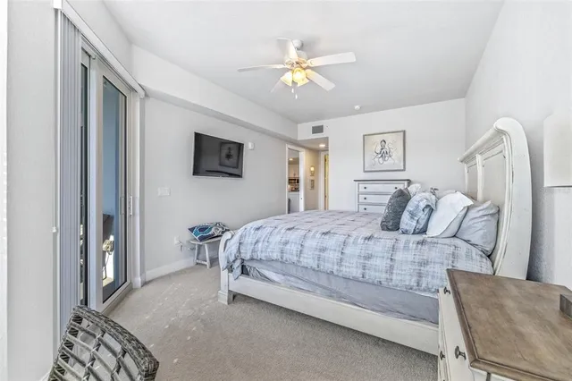 a bathroom with a granite countertop sink mirror vanity and toilet