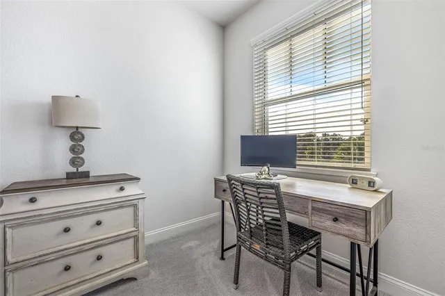 a bathroom with a granite countertop shower a sink and a mirror