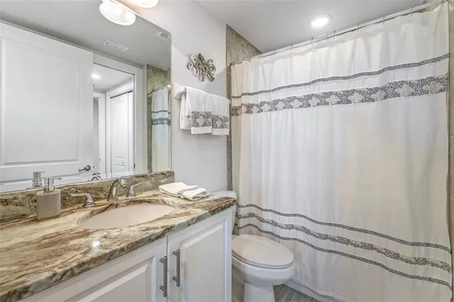 a view of a balcony with wooden floor