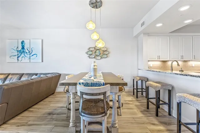 a kitchen with stainless steel appliances granite countertop a refrigerator stove and microwave