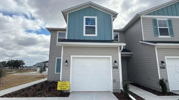 a front view of a house with yard