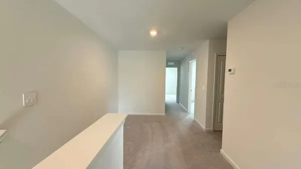 a view of a room with an empty space