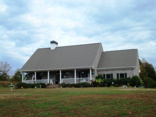 Four side brick ranch on five gentle acres.