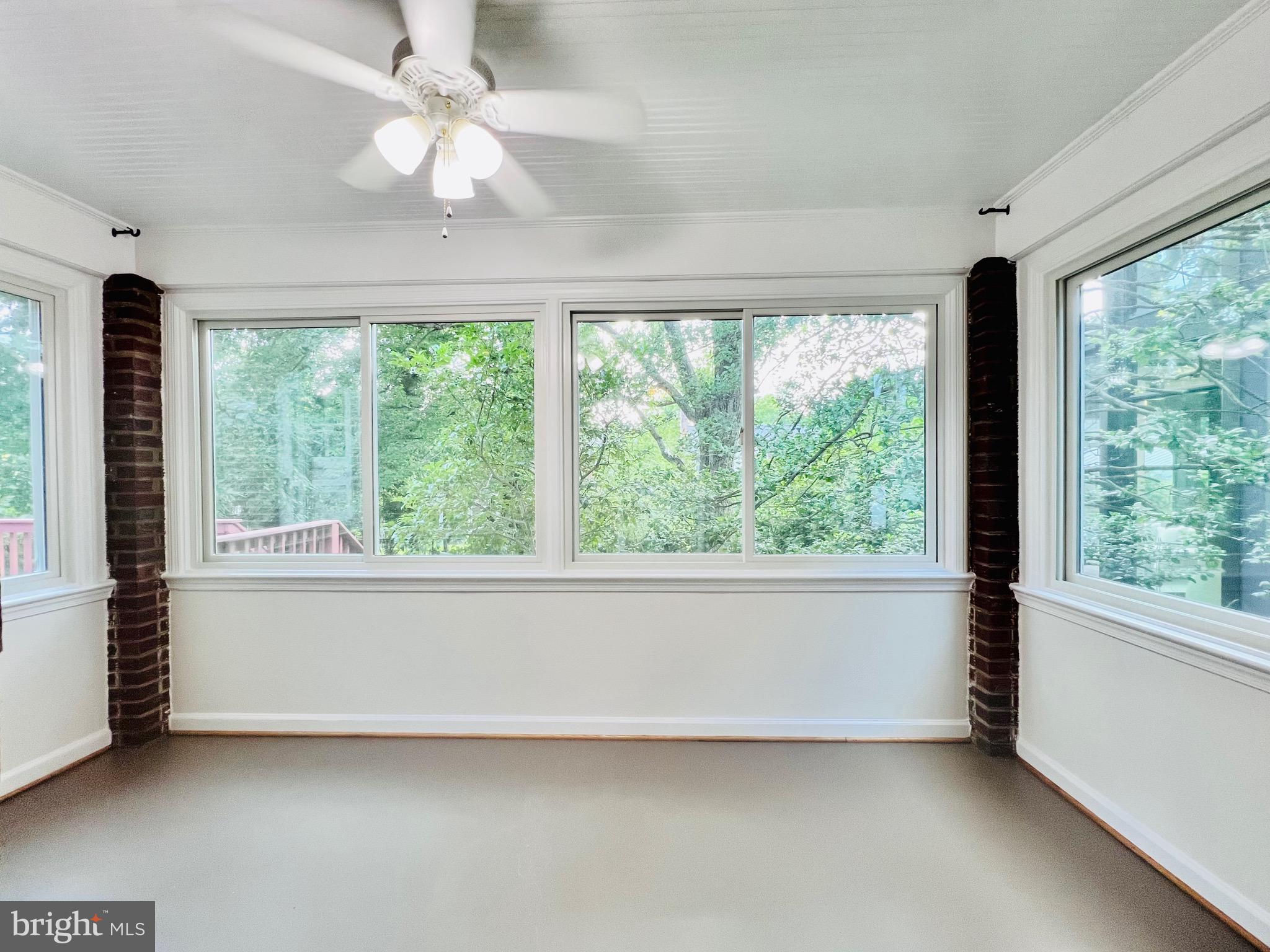 7208 Exeter Road Bethesda, MD 20814 - Photo 13 of 26 a view of empty room with large windows