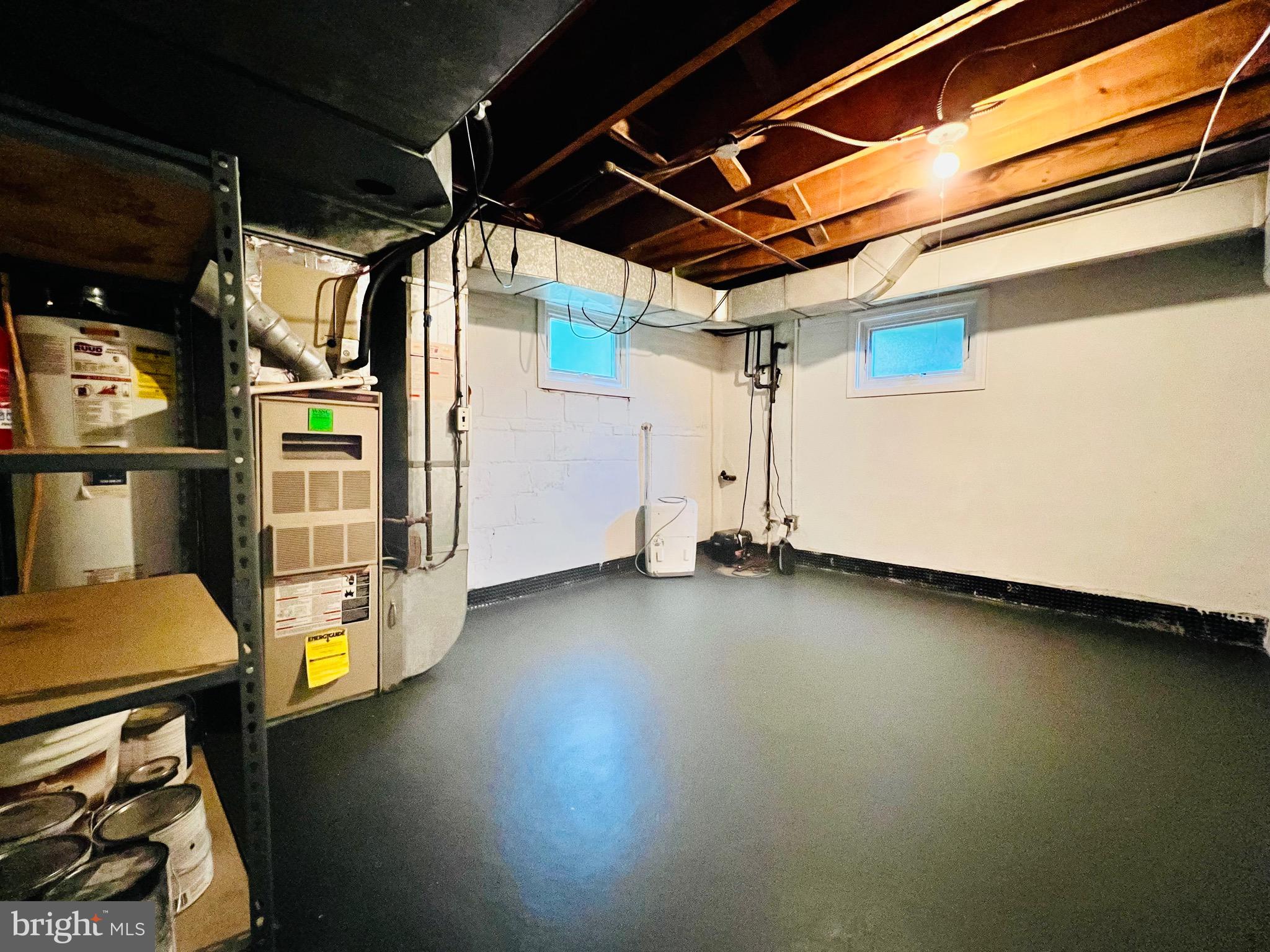 7208 Exeter Road Bethesda, MD 20814 - Photo 25 of 26 a view of a storage room with wooden floor and furniture