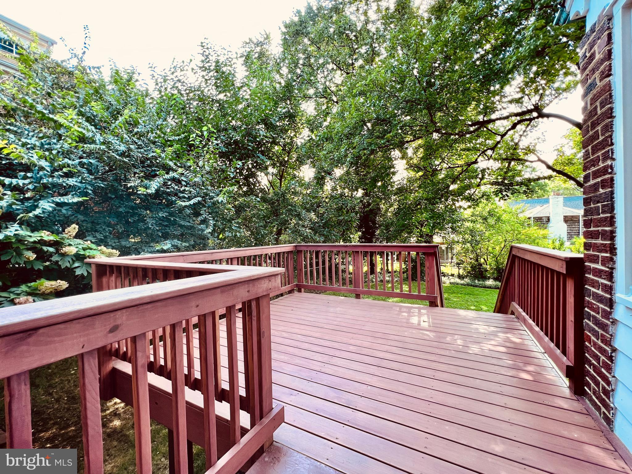 7208 Exeter Road Bethesda, MD 20814 - Photo 10 of 26 a balcony with wooden floor and fence