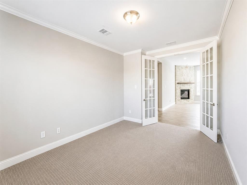 6209 Cupleaf Road Flower Mound, TX 76226 - Photo 22 of 29 Carpeted room with crown molding and white baseboards