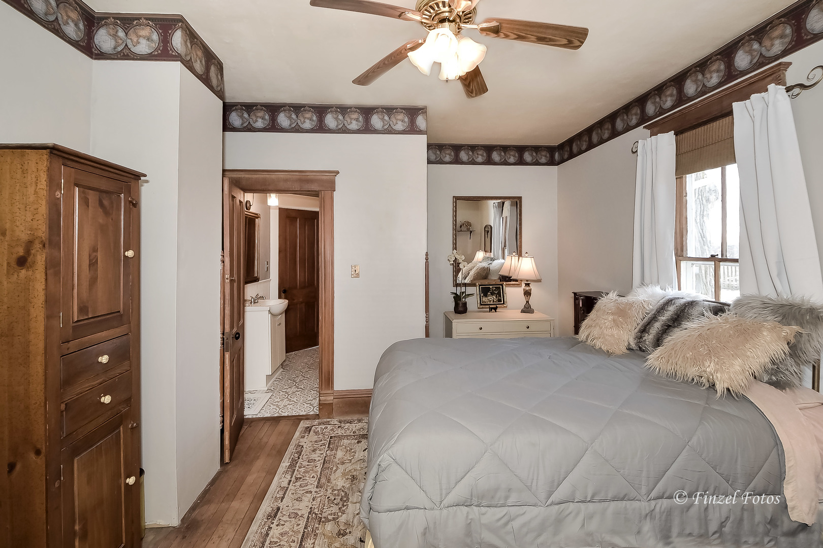 14N152 Reinking Road Pingree Grove, IL 60140 - Photo 8 of 15 a bedroom with a bed and a chandelier