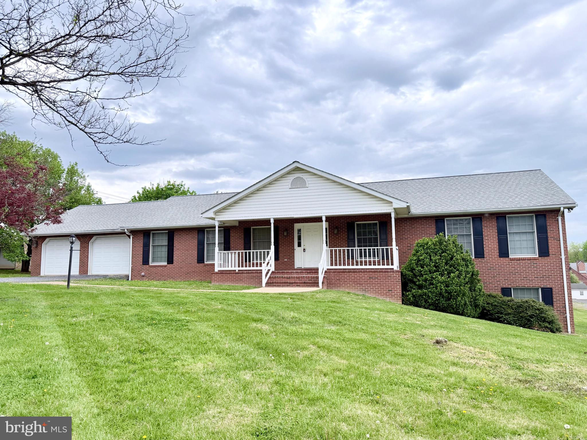 78 Brook Creek Road Toms Brook, VA 22660 - Photo 1 of 43 a front view of a house with a garden and trees