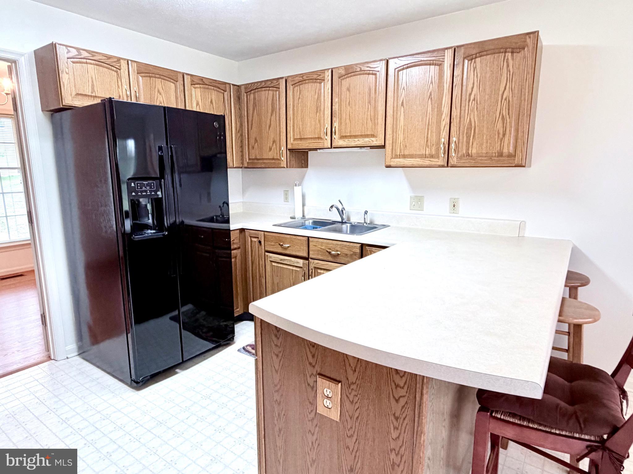 78 Brook Creek Road Toms Brook, VA 22660 - Photo 11 of 43 a kitchen with stainless steel appliances a refrigerator sink and cabinets