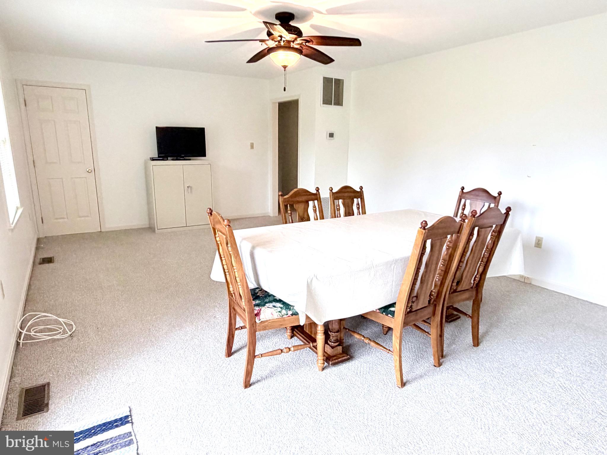 78 Brook Creek Road Toms Brook, VA 22660 - Photo 14 of 43 a dining room with furniture and window
