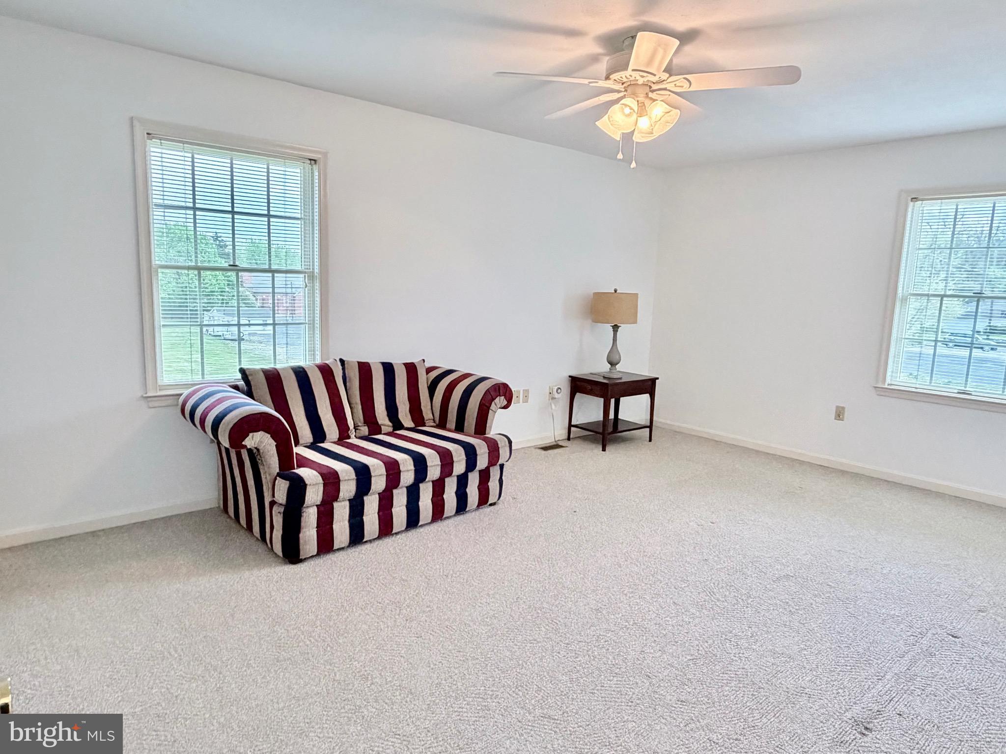 78 Brook Creek Road Toms Brook, VA 22660 - Photo 29 of 43 a bedroom with a bed and a chandelier