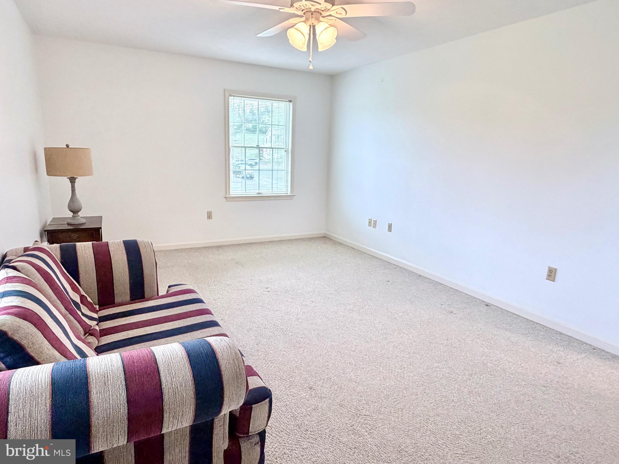 78 Brook Creek Road Toms Brook, VA 22660 - Photo 30 of 43 a bedroom with a bed and a chandelier