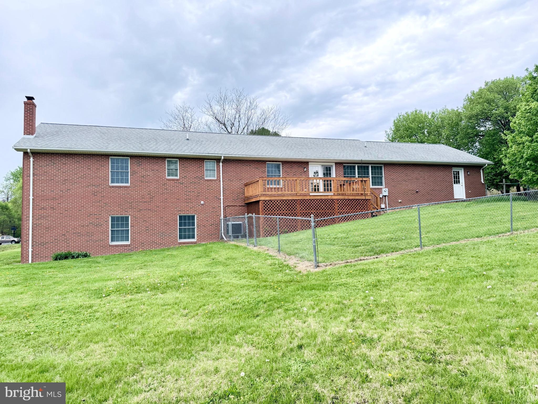 78 Brook Creek Road Toms Brook, VA 22660 - Photo 41 of 43 a front view of a house with a yard and garage