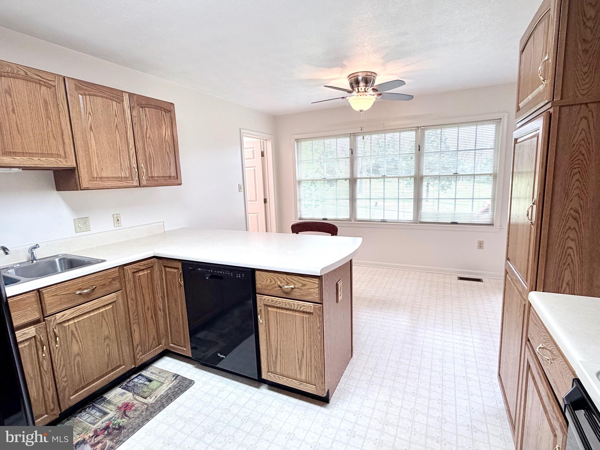 78 Brook Creek Road Toms Brook, VA 22660 - Photo 9 of 43 a kitchen with a sink cabinets and window