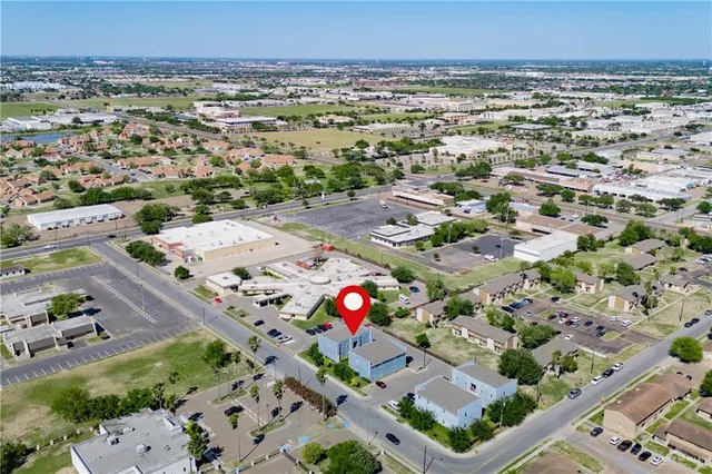 an aerial view of residential houses with outdoor space
