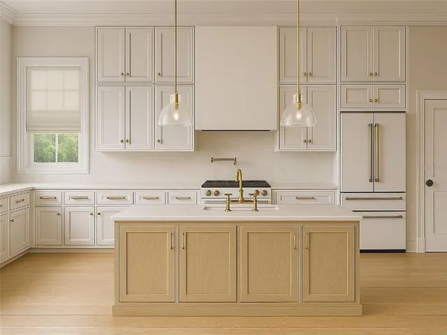 a kitchen with white cabinets and sink