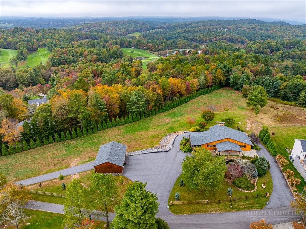 186 Woodcrest Road Glade Valley, NC 28627 - Photo 1 of 50 an aerial view of a house
