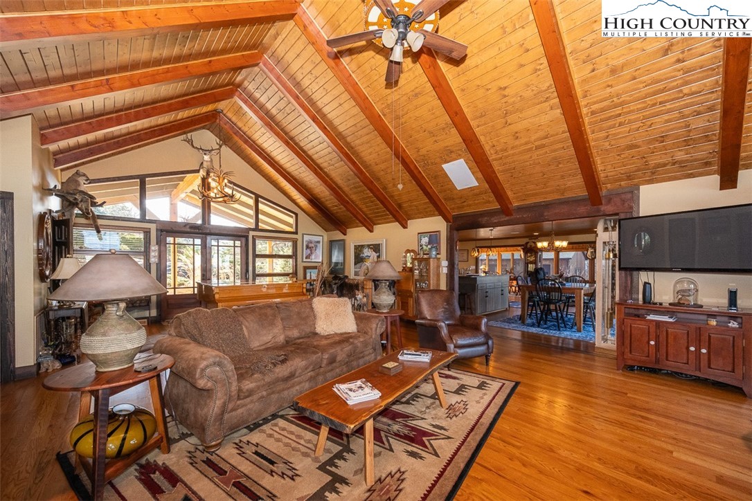 186 Woodcrest Road Glade Valley, NC 28627 - Photo 17 of 50 a living room with furniture and a chandelier