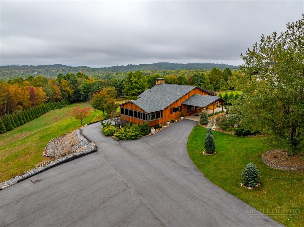 186 Woodcrest Road Glade Valley, NC 28627 - Photo 2 of 50 an aerial view of a house with big yard