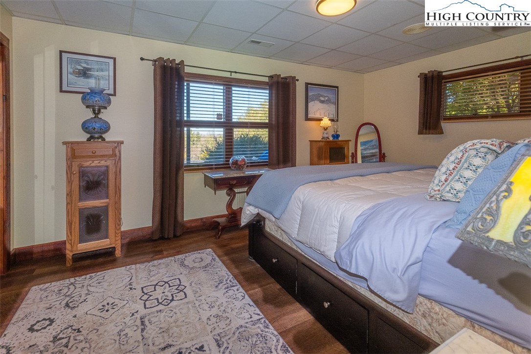 186 Woodcrest Road Glade Valley, NC 28627 - Photo 27 of 50 a bedroom with a bed and a table in it