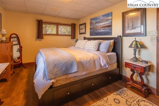 a bedroom with a bed and dresser