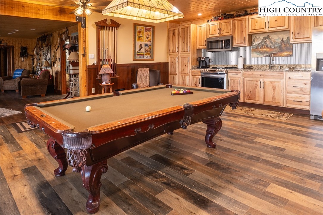 186 Woodcrest Road Glade Valley, NC 28627 - Photo 29 of 50 a room with pool table and chairs