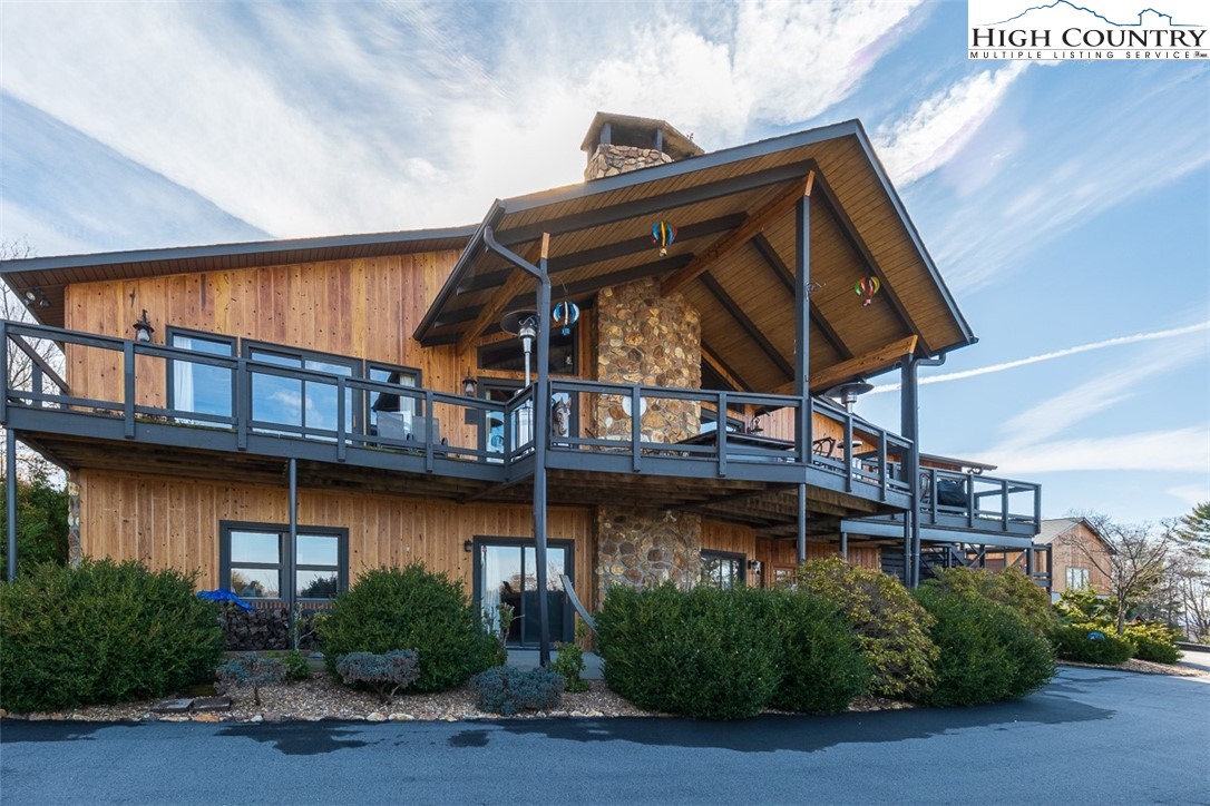 186 Woodcrest Road Glade Valley, NC 28627 - Photo 34 of 50 a view of a house with large windows