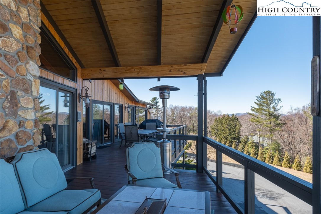 186 Woodcrest Road Glade Valley, NC 28627 - Photo 35 of 50 a view of a chairs and couches in the balcony