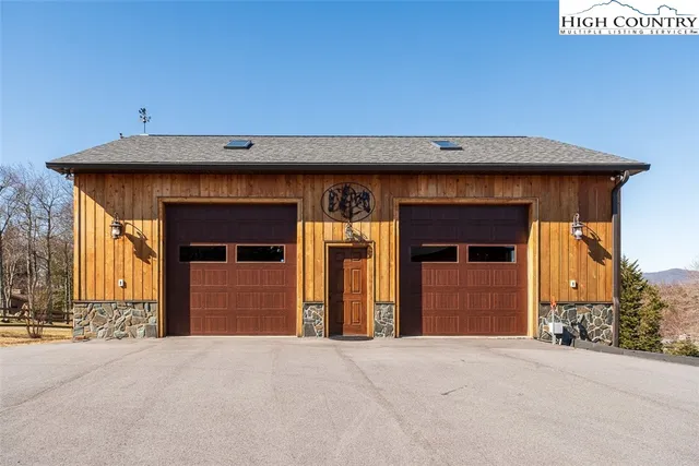 a view of outdoor space garage and front door