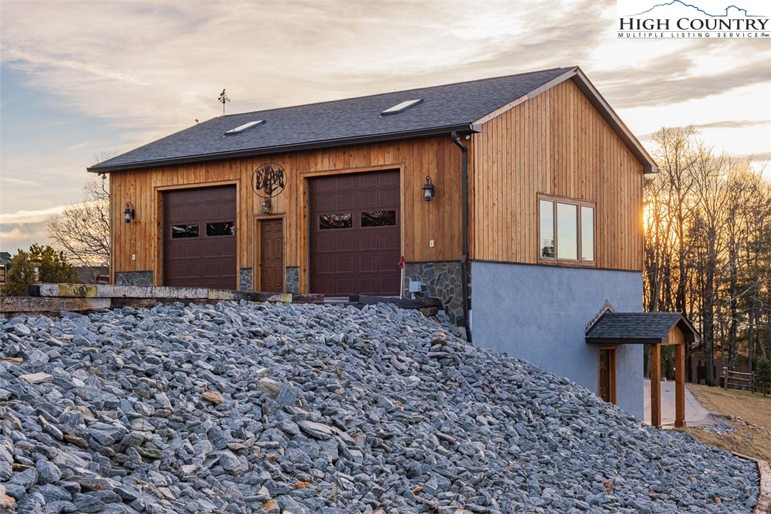 186 Woodcrest Road Glade Valley, NC 28627 - Photo 42 of 50 a front view of a house with garden