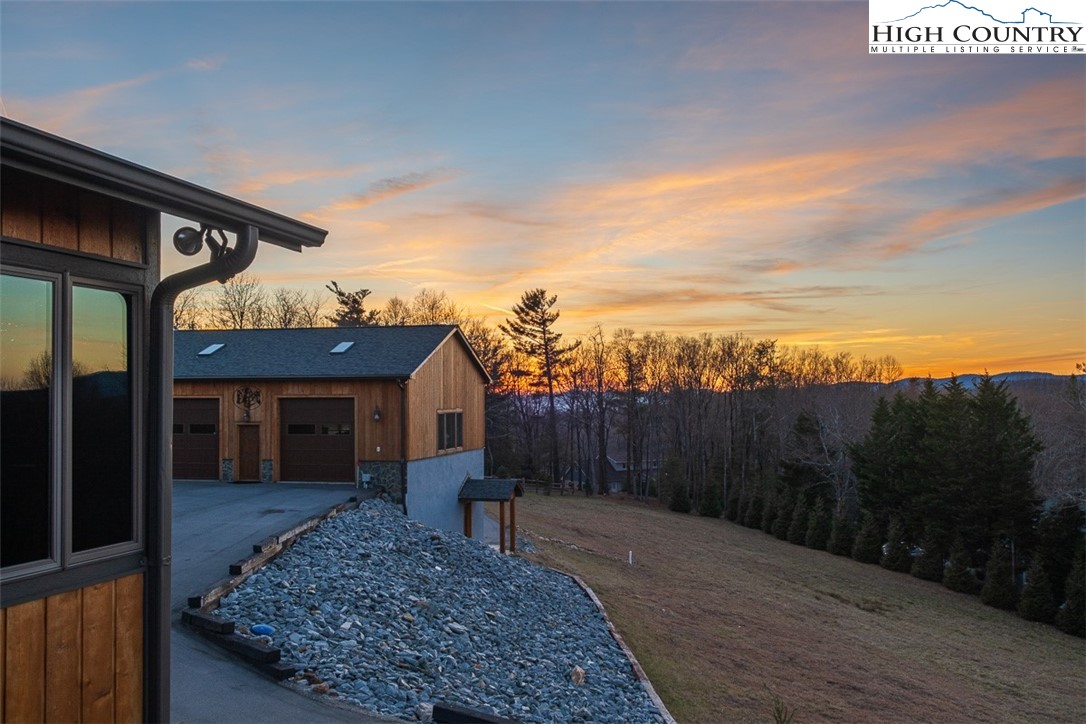 186 Woodcrest Road Glade Valley, NC 28627 - Photo 48 of 50 a front view of a house with a yard and trees