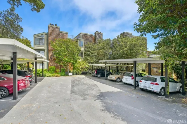 a view of a city street with tall buildings