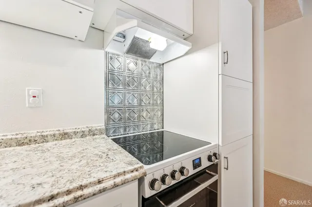 a view of a storage and utility room with washer and dryer