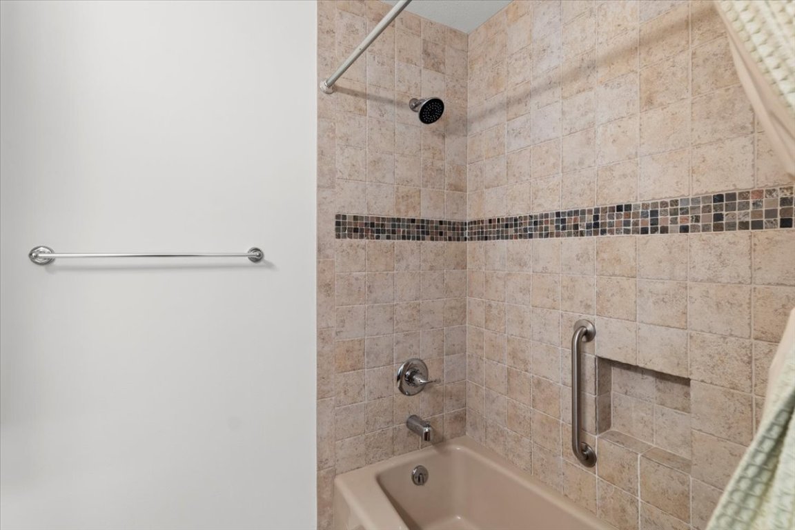 16808 Forest Way Austin, TX 78734 - Photo 21 of 33 a bathroom with a shower and a bathtub