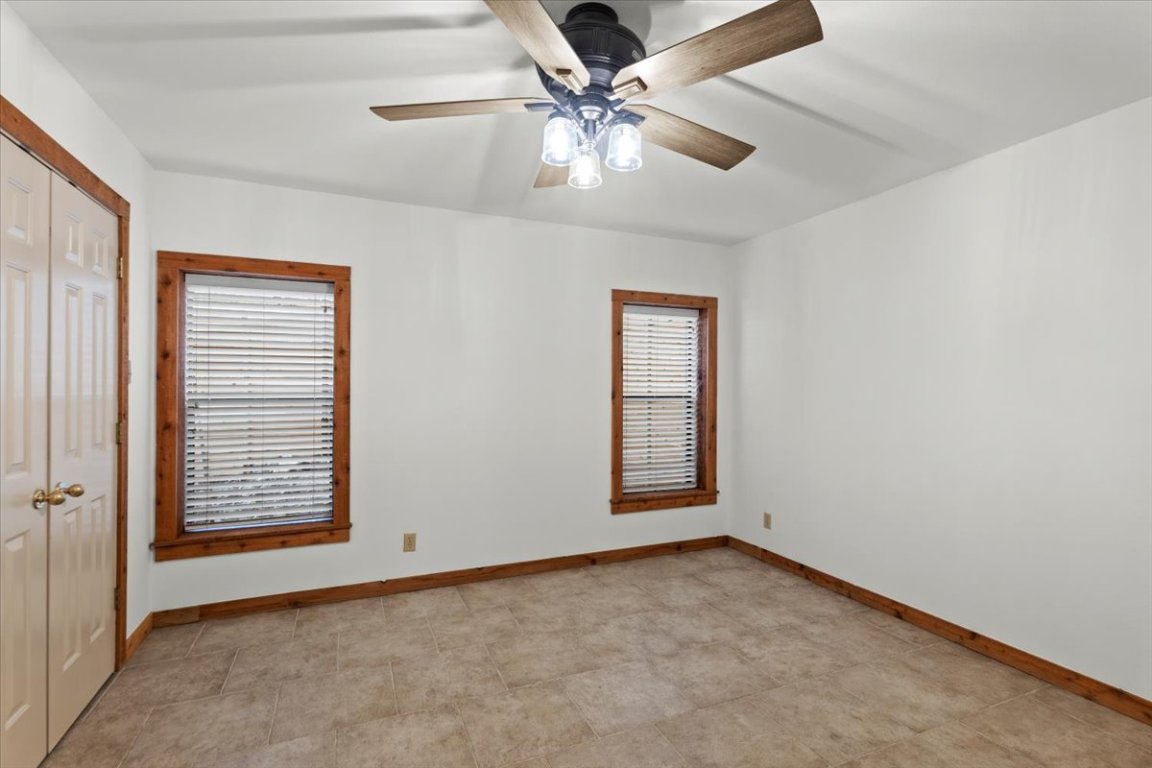 16808 Forest Way Austin, TX 78734 - Photo 24 of 33 an empty room with windows and fan
