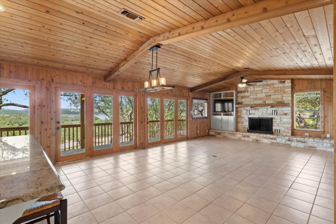 16808 Forest Way Austin, TX 78734 - Photo 10 of 33 The spacious great room has a wall of windows to enjoy both the lake and hill country views.