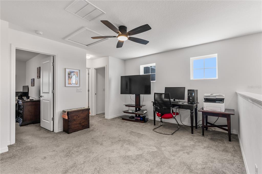 5637 Beggs Road St. Cloud, FL 34771 - Photo 17 of 35 a view of a livingroom with workspace and a window