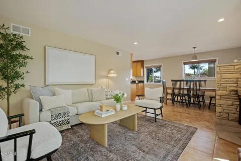 a living room with furniture and a table