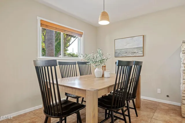 a view of a dining room with furniture window and outside view