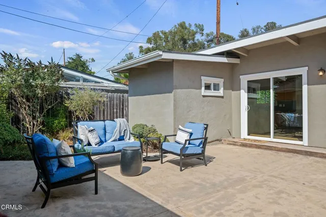 a outdoor living space with furniture and a potted plant