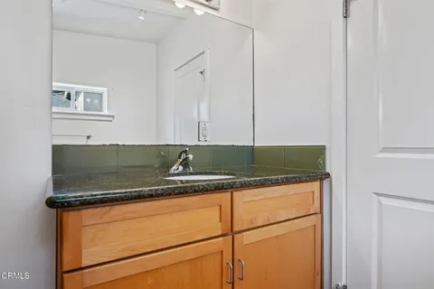 a kitchen with granite countertop cabinets and sink